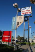 Thorson Buick/Pontiac/GMC/Isuzu, faded "Used Trucks" banner